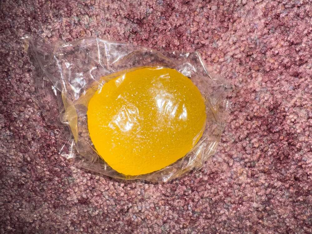 Yellow Gum Drop Squeeze Ball Squishy Toy in Plastic Packaging